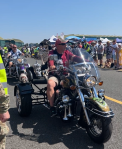 A trike enthusiast heading the motorbike cavalcade 